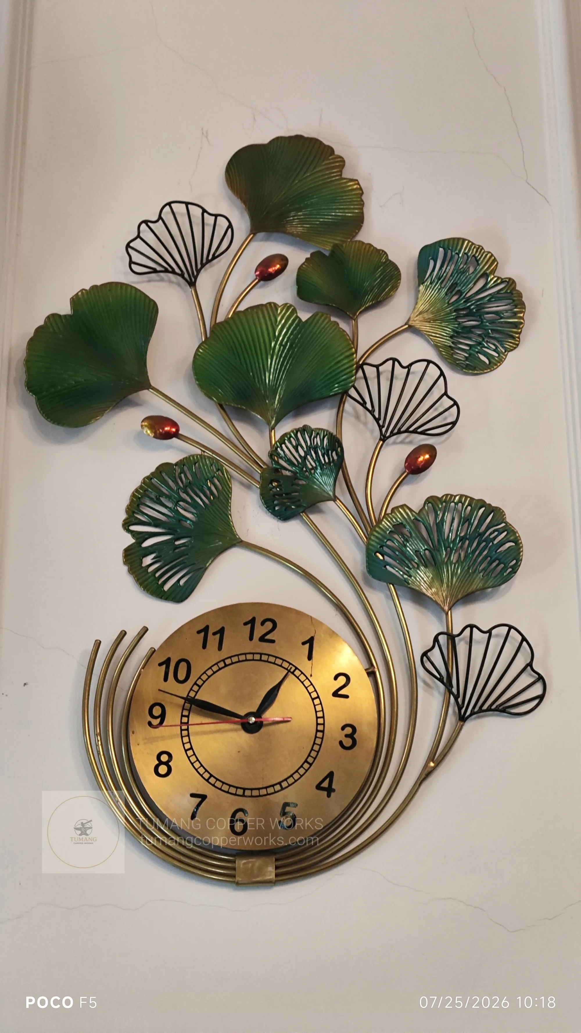 Handcrafted copper decorative clock with botanical leaf artwork